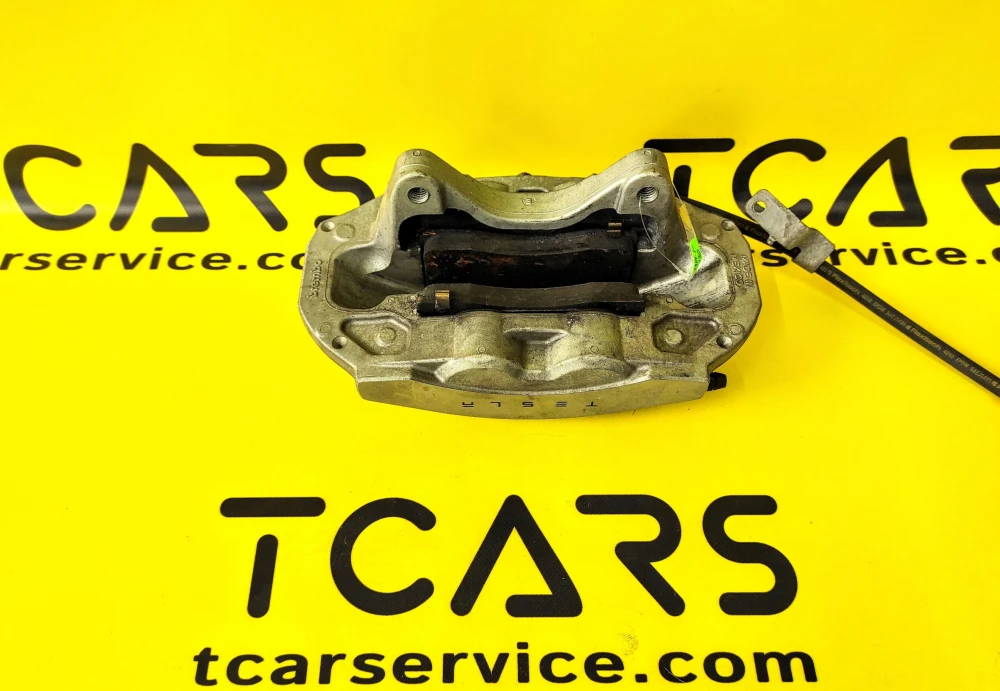 Tesla Model 3 2017-2023 Front Left Brake Caliper BASE with Brake Pads OEM (used) 1044621-00-E  Photo №2