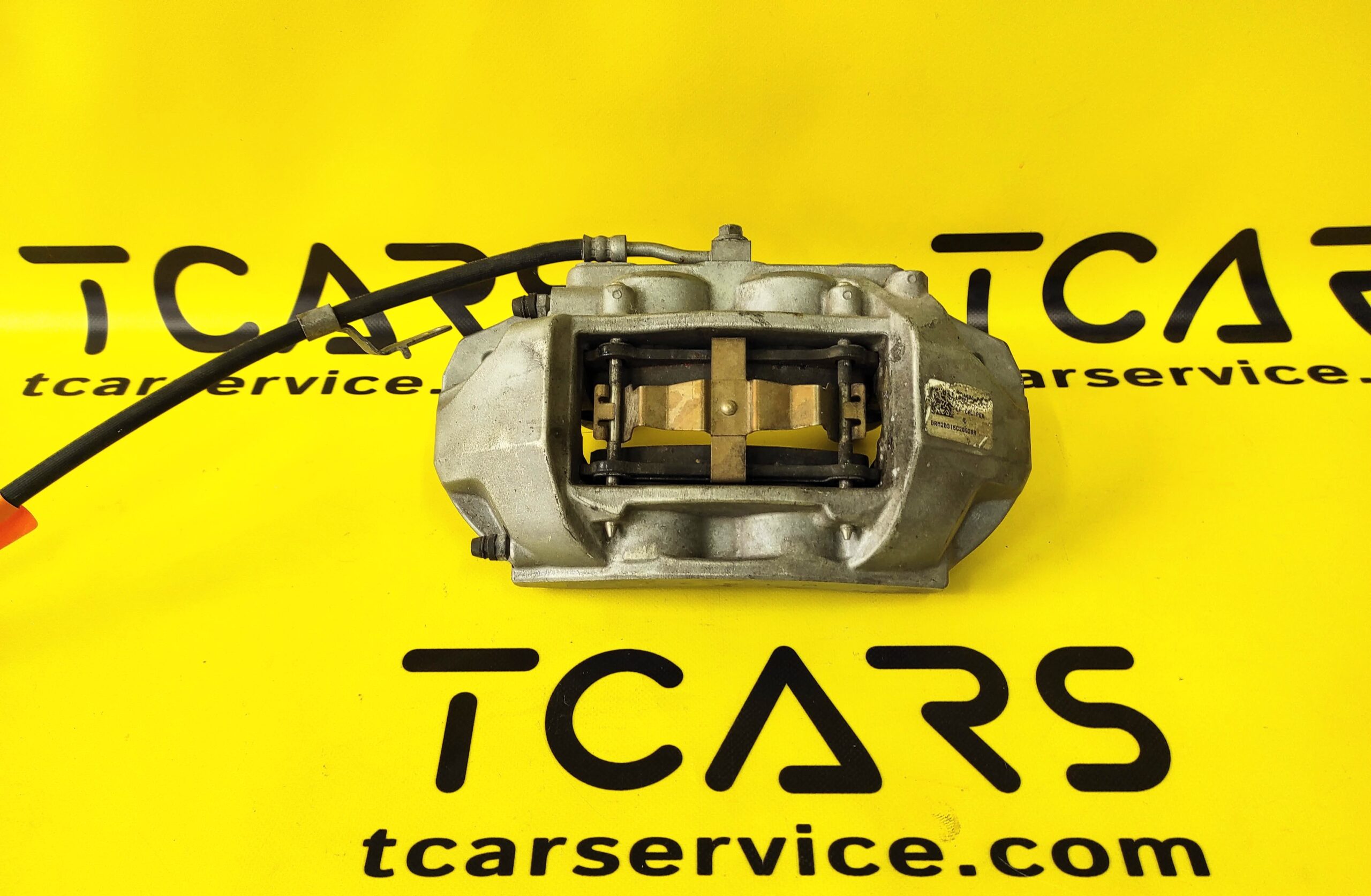 Tesla Model 3 2017-2023 Front Left Brake Caliper BASE with Brake Pads OEM (used) 1044621-00-E