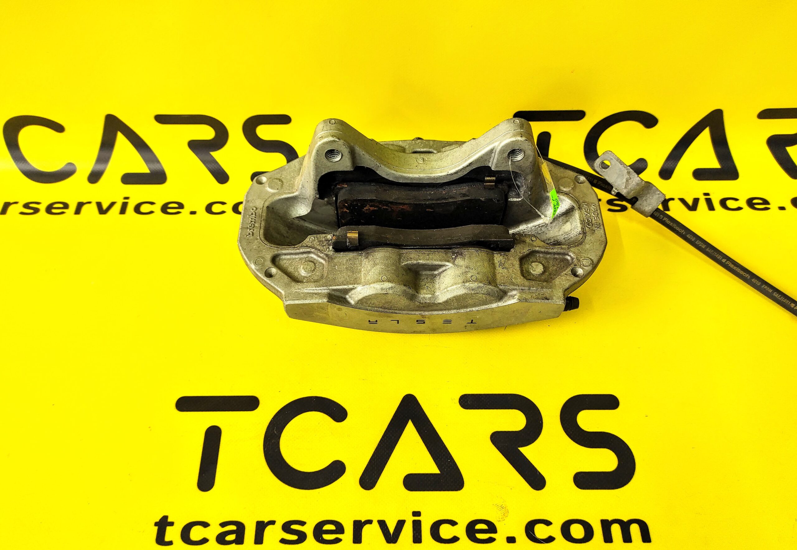 Tesla Model 3 2017-2023 Front Left Brake Caliper BASE with Brake Pads OEM (used) 1044621-00-E  Photo №2